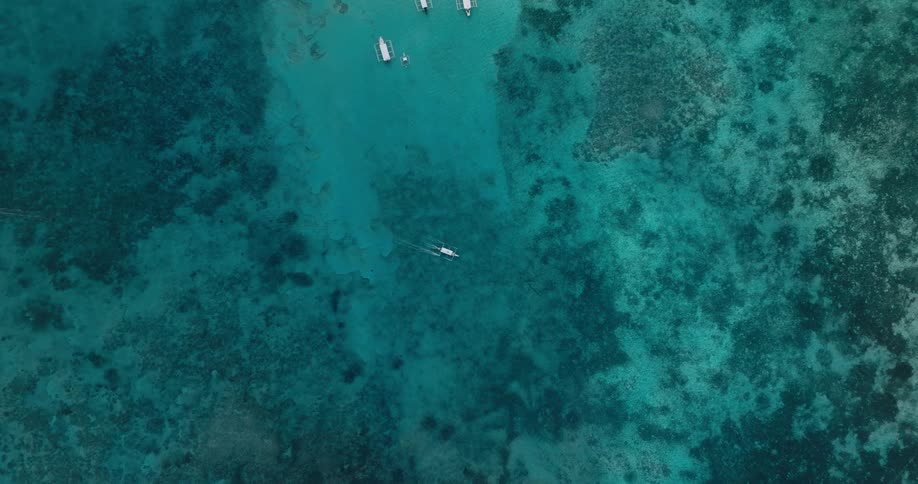 Boats are traveling in the ocean