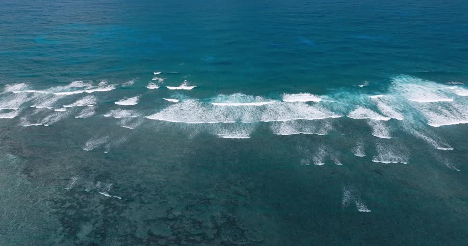 Waves spread out in the blue waters