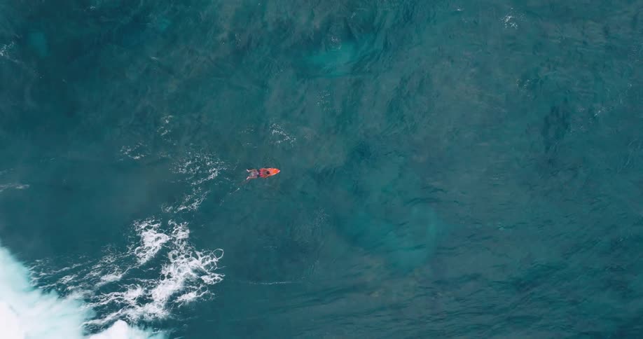 Person surfing in the middle of the sea
