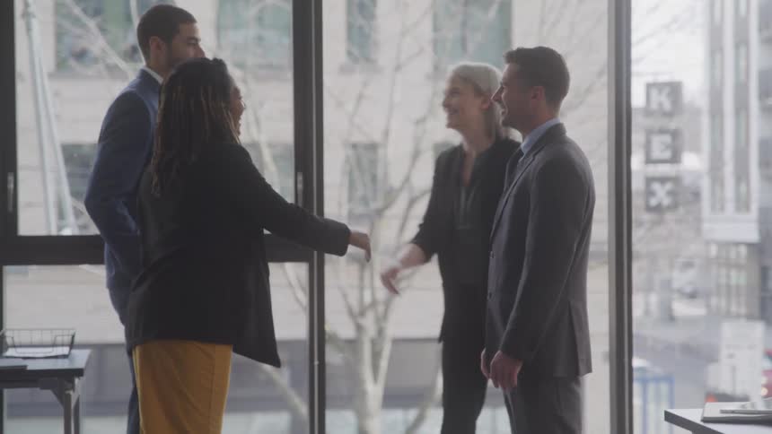 People greet each other in the office