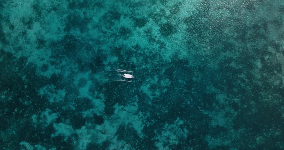 A small boat moves in the water
