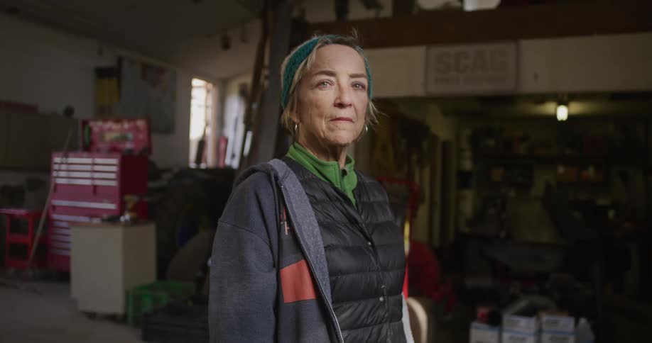 A woman is surrounded by tools in the room