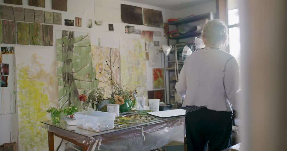 The painters studio is full of paintings