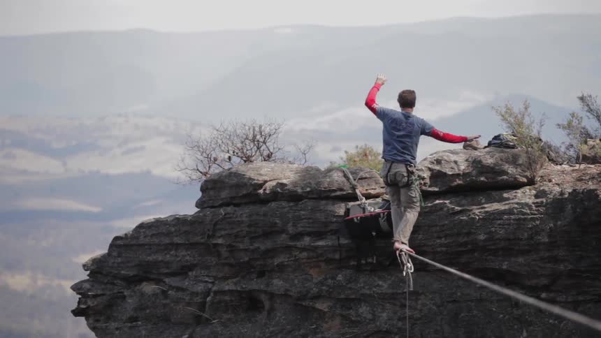 A person tightrope walking