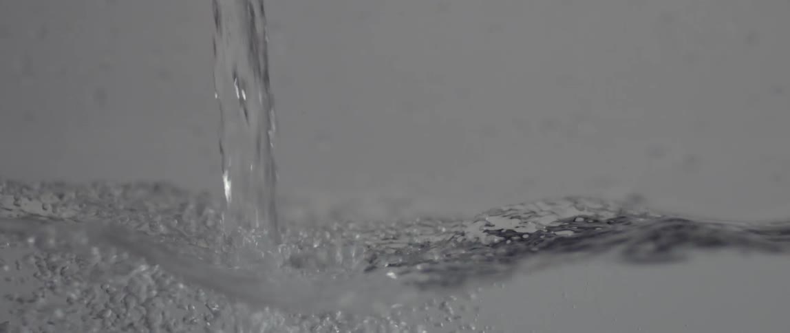 Water pours into a container