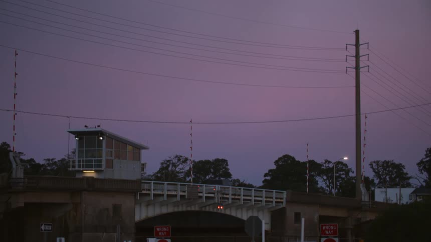 Cars are crossing the small bridge in town