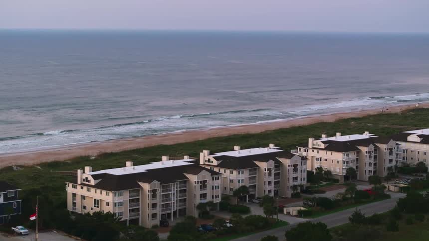 Blocks of condos are close to a beach area
