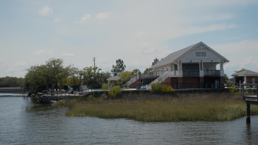 A footage of a house close to the river