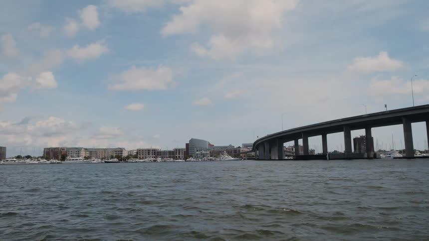 A long bridge leads to the city
