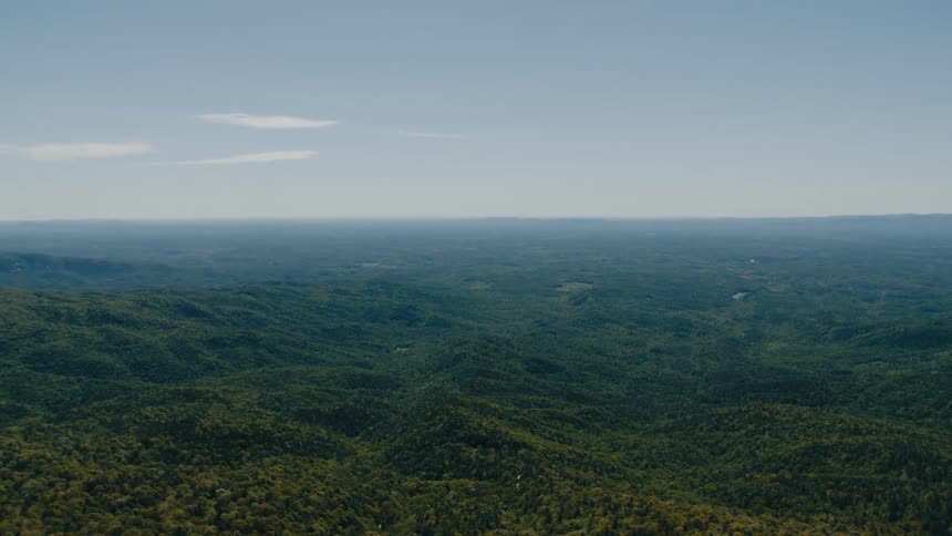 The landscape is covered with heavy forests