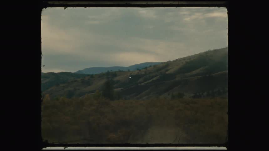 Mountains and grass cover the area