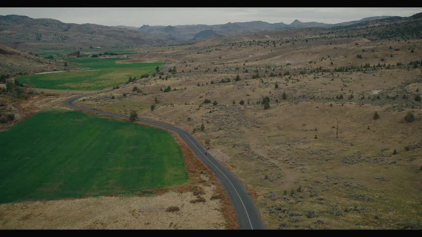 A car driving down a country road