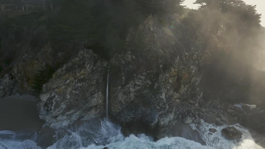 Heavy waves crash against this shore cliff side