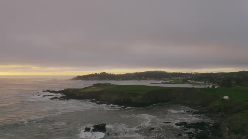 Waves crash into the rocky shoreline