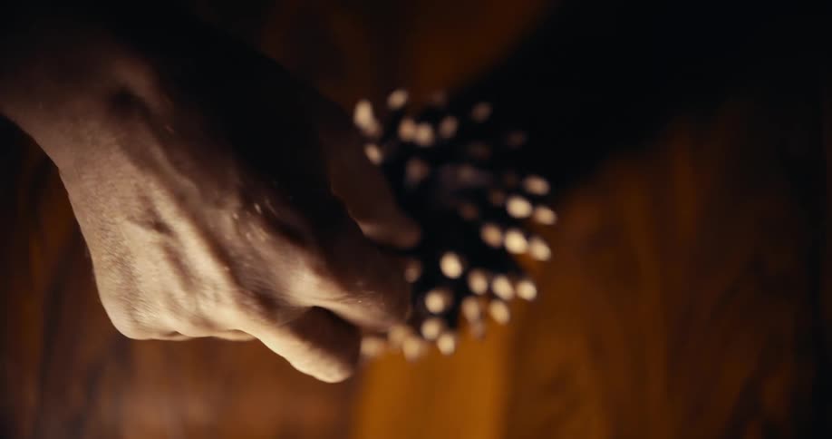 A person picking up a pencil from a bunch of pencil