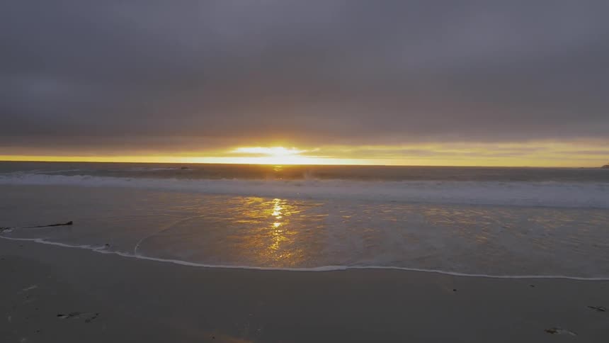 The sun sets over the ocean