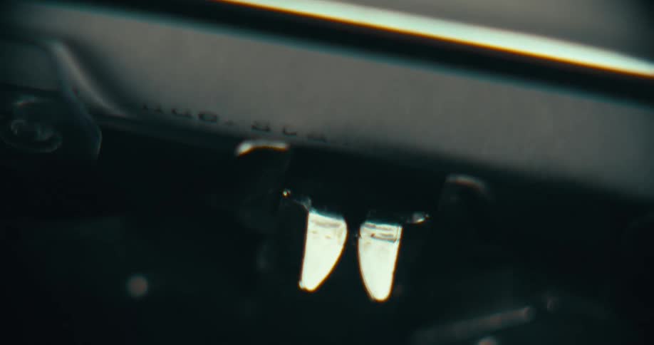 A typewriter is printing on paper