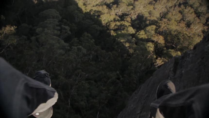 Feet dangling over a cliff