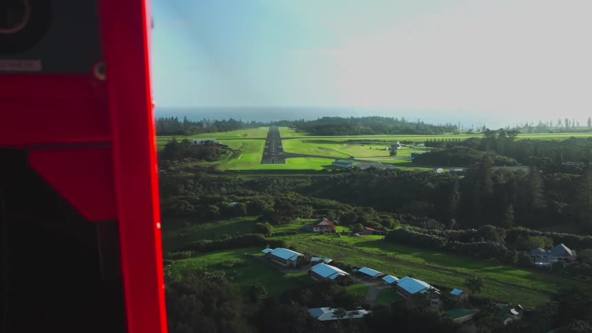Aerial view of a quaint village shown from an airplane in the sky