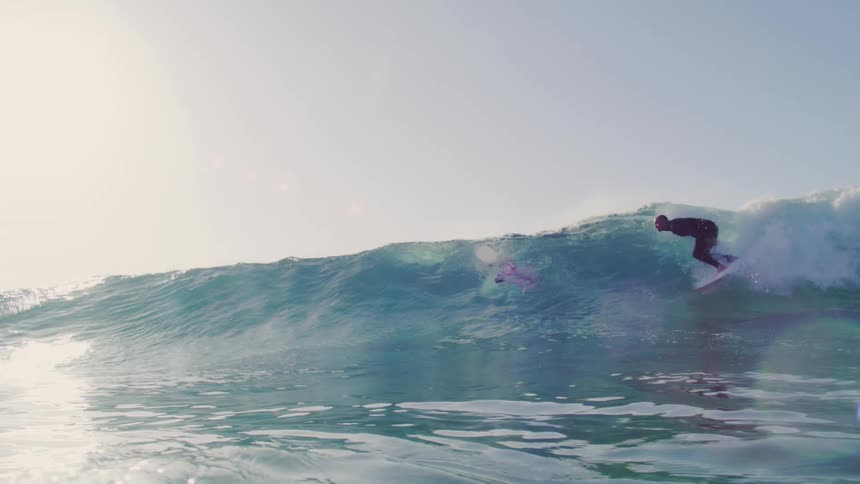 Boys surfing in the waves