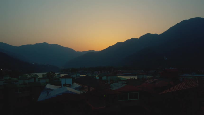 Morning light warms Agra’s suburban area near the mountains
