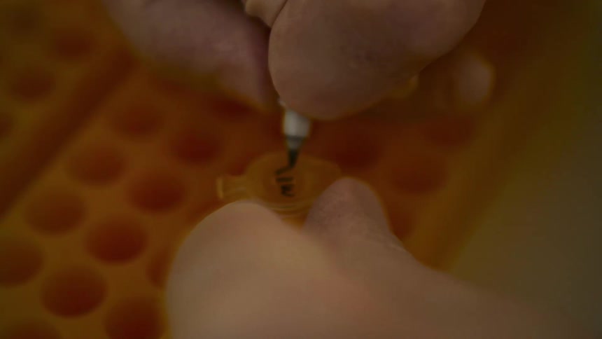 A footage of a person writing on an object