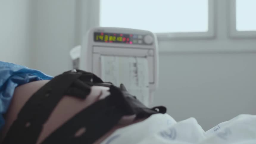 A pregnant woman is having tests done in the hospital