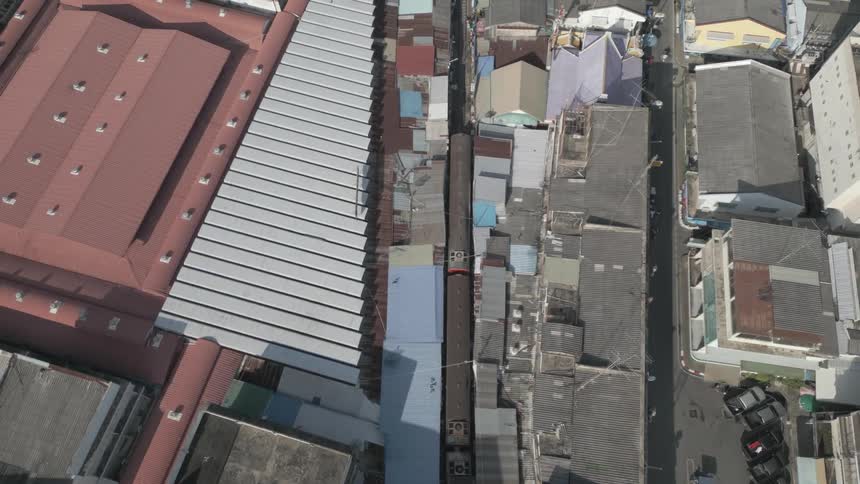 Aerial view of a train station in an urban area