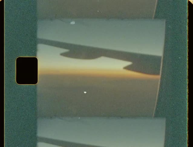 A plane is flying at sunrise