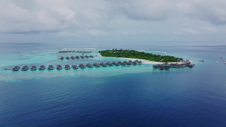 Homes are built on the water by the small island