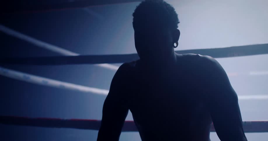 A boxer taking a break from a fight