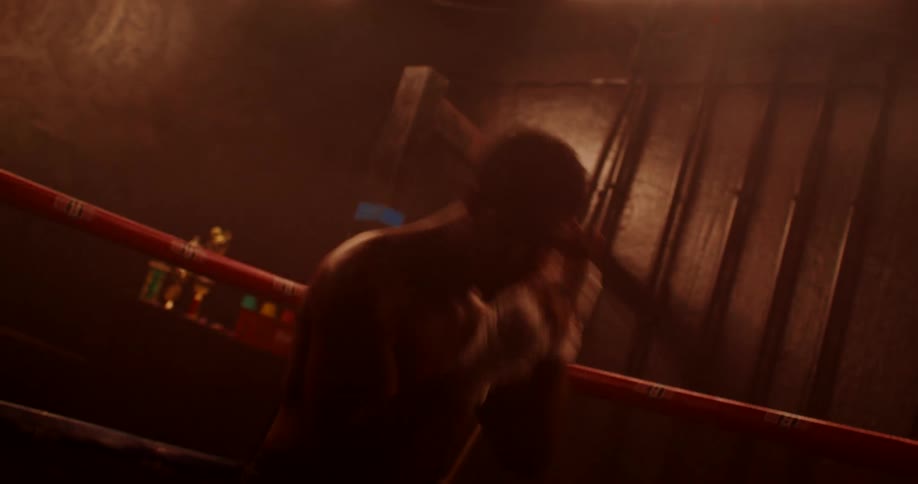 A man is practicing his boxing moves inside the ring