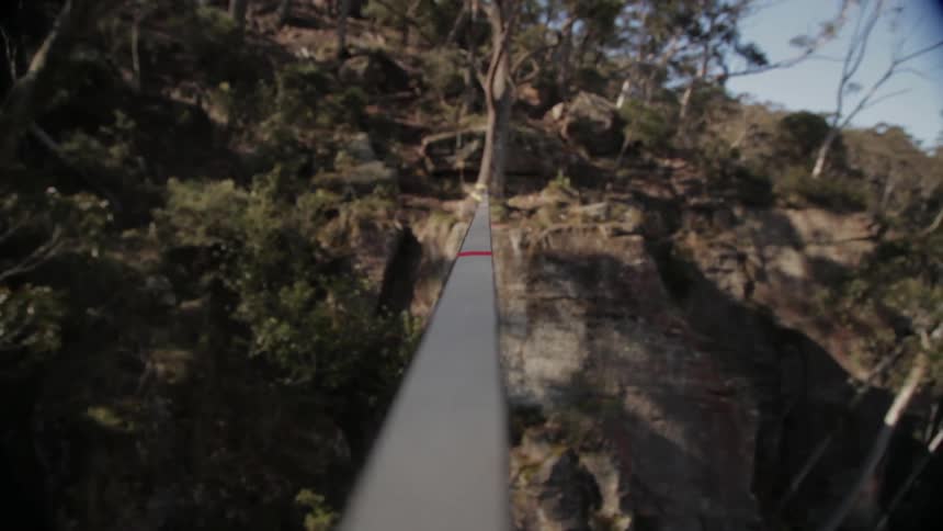 A tightrope across a cliff