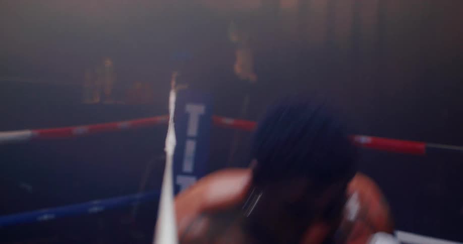 Boy boxing training in a gymnasium