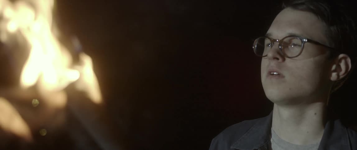 A close up view of someone holding a torch