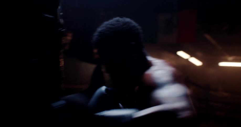 A man is punching the heavy bag