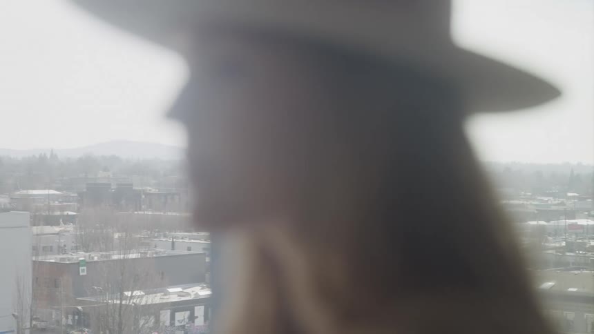 A footage of a lady in a room