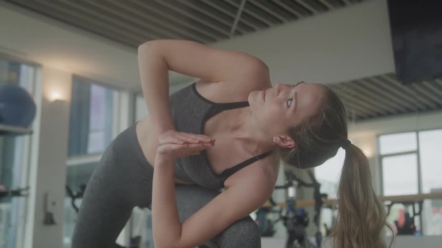 Girl at the gym doing a yoga move