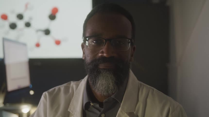 Black gentleman looking toward the camera