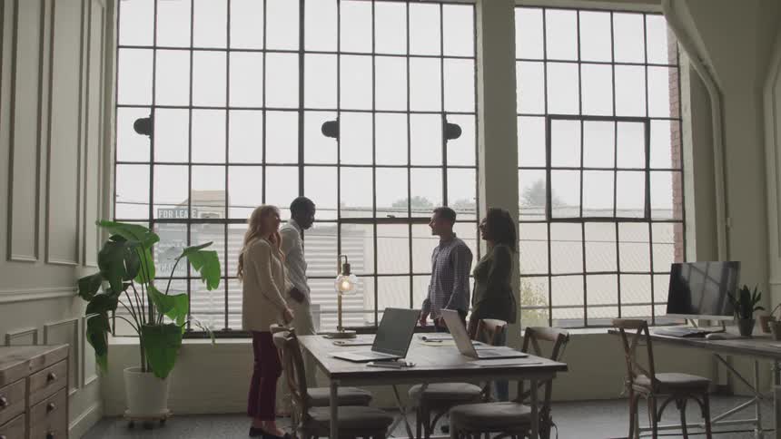 A footage of people exchanging pleasantries in the office