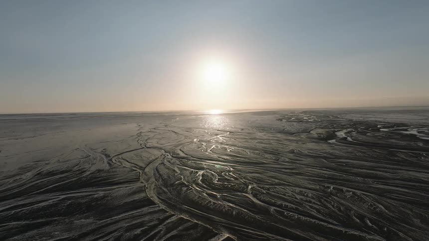 The sun is rising on the landscape