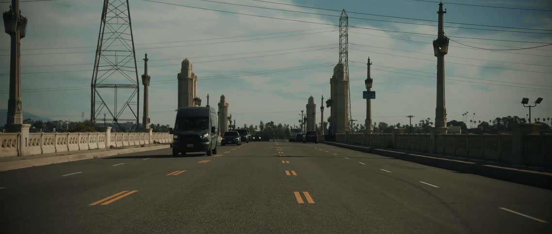 Cars driving over a bridge