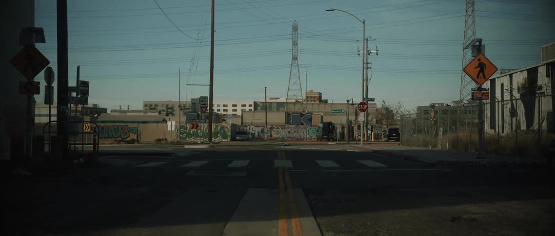 Moving along a street toward a power plant