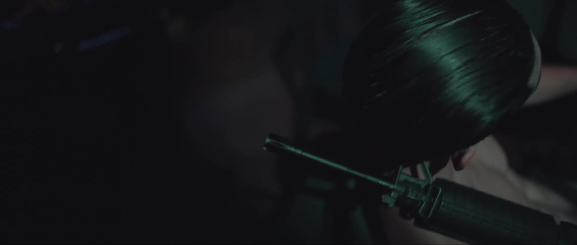 A man is holding a rifle