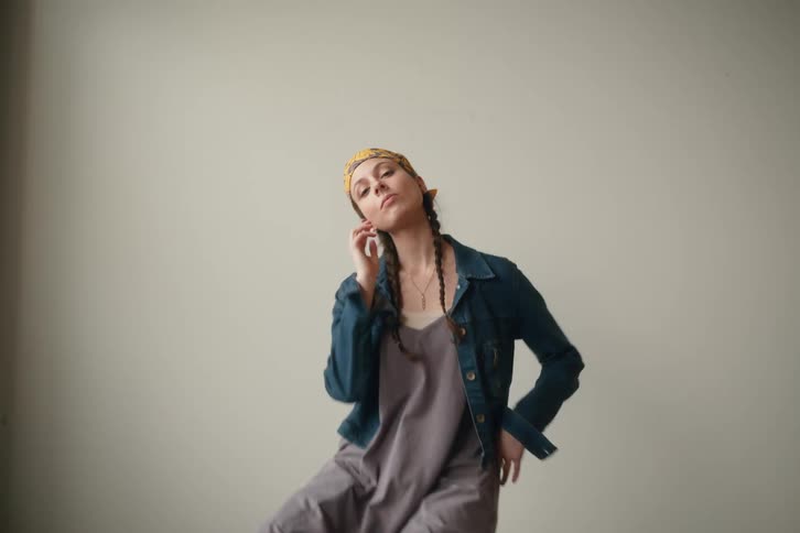 A model is posing on the chair