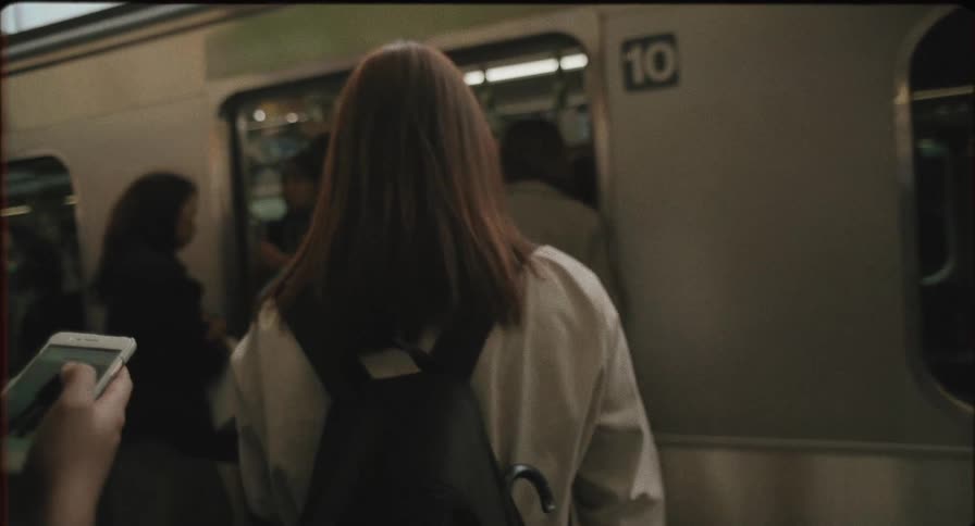 People get on the train in the subway