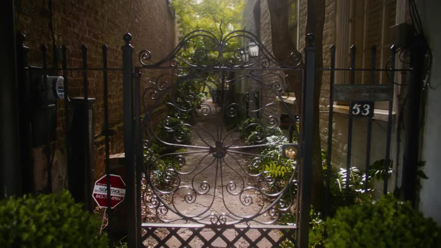 A footage of a person walking towards a door entrance