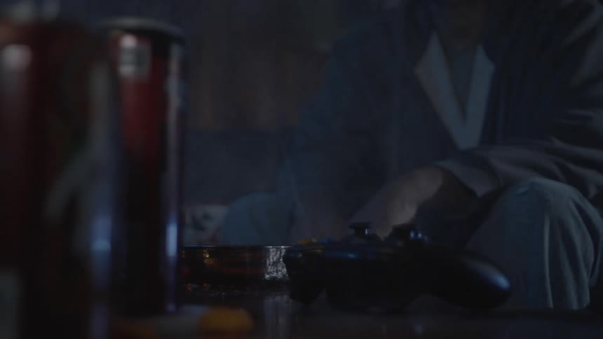 A footage of a person holding a game pad