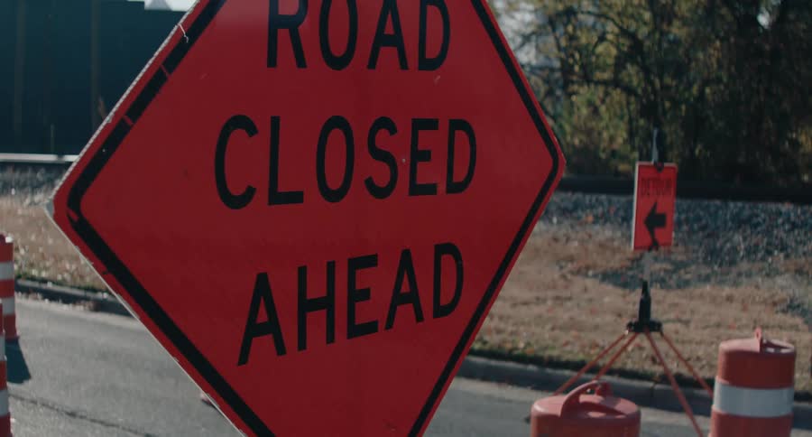 Road closure sign on a road in the city