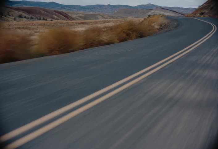 The road is empty by the hills